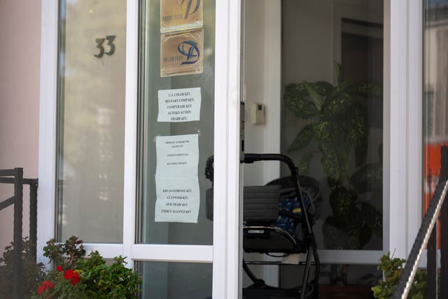 A sign featuring the names of several companies on the door of a house where a Hungarian company that allegedly manufactured pagers that exploded in Lebanon is headquartered in Budapest