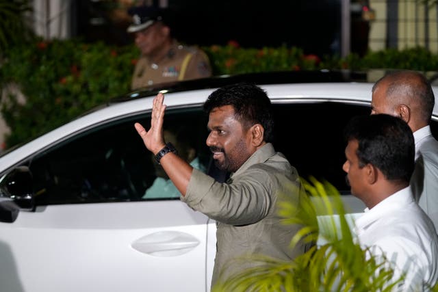 Anura Kumara Dissanayake waves as he arrives at the Election Commission office after winning Sri Lankan presidential election, in Colombo, Sri Lanka 