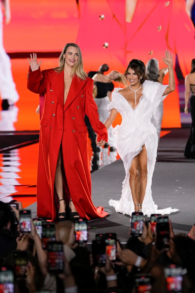 Cara Delevingne, left, and Eva Longoria wear creations as part of the L'Oreal Spring/Summer 2025 collection presented Monday, Sept. 23, 2024 in Paris