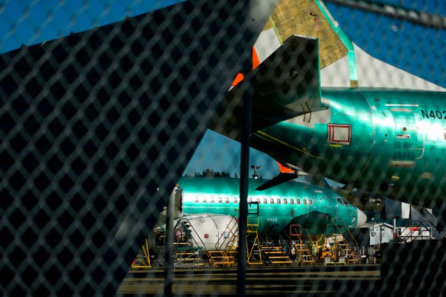 Boeing 737 Max aircrafts are seen behind fences