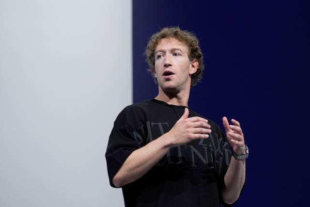 Mark Zuckerberg gestures while talking on stage about the Orion AR glasses during the Meta Connect conference in Menlo Park, California 