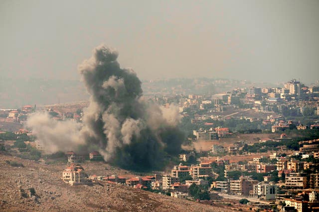 Smoke rises from Israeli air strikes in the southern village of Kfar Rouman, seen from Marjayoun, south Lebanon