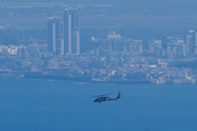 An Israeli Air Force Black Hawk helicopter flies over the Mediterranean Sea near the northern Israeli city of Kiryat Yam