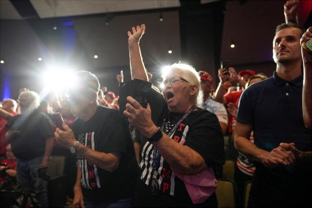 Supporters cheer as Donald Trump speaks at a campaign event in Prairie du Chien