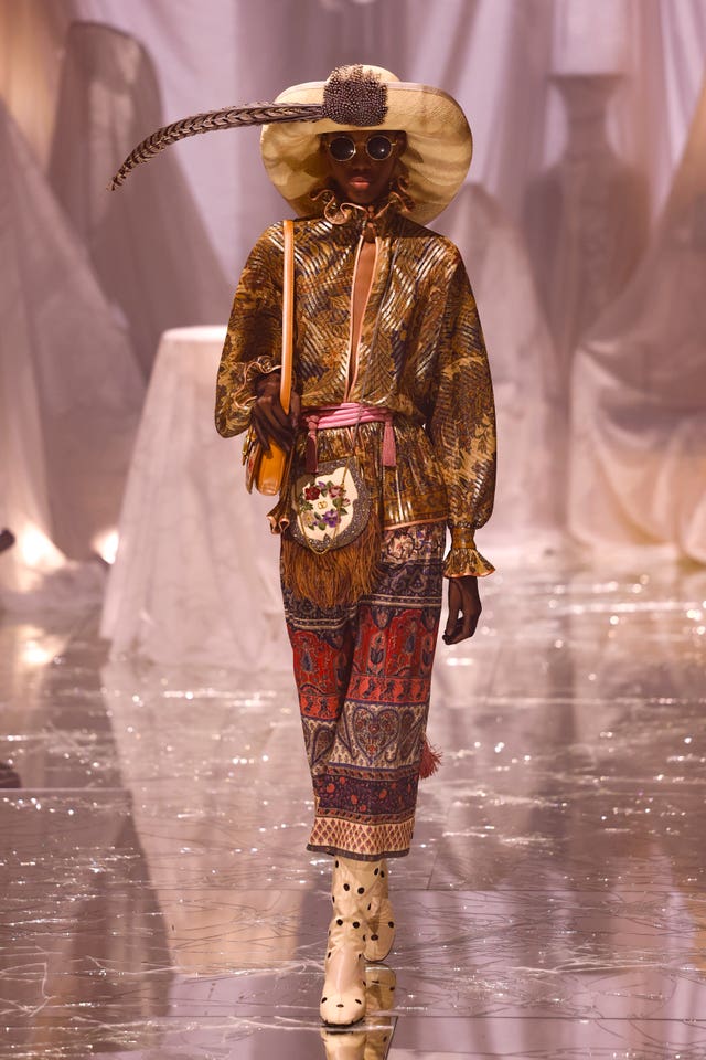 A model wears a creation as part of the Valentino Spring/Summer 2025 collection