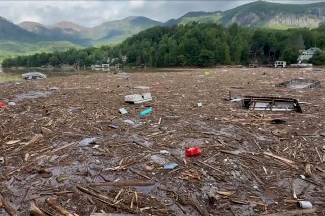 Flood debris from Hurricane Helene floats by 