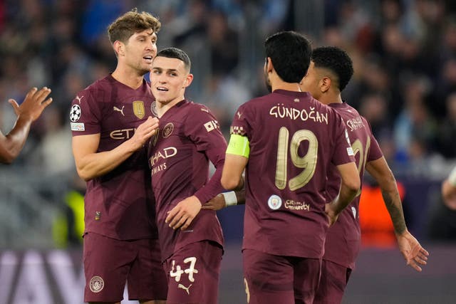 Phil Foden, centre left, celebrates his goal with, from left, John Stones, Ilkay Gundogan and Savinho