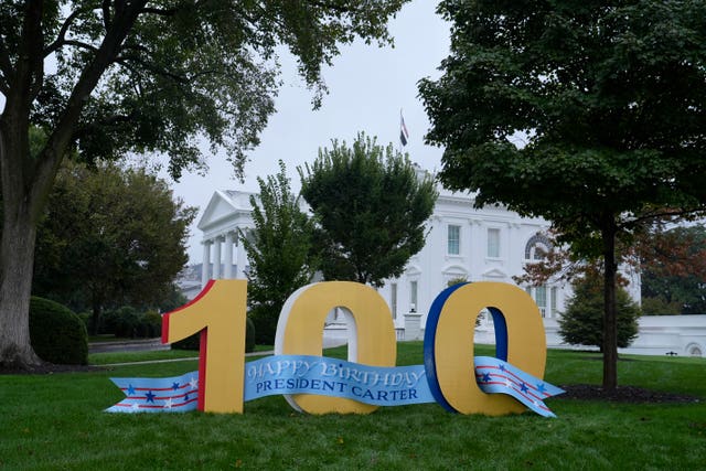 A sign wishing Mr Carter a happy 100th birthday sits on the North Lawn of the White House in Washington 