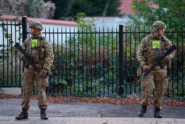 Military police officers stand guard