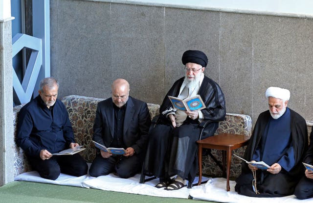 Supreme Leader Ayatollah Ali Khamenei, second right, at a ceremony commemorating killed Hezbollah leader Hassan Nasrallah at Imam Khomeini grand mosque in Tehran, Iran