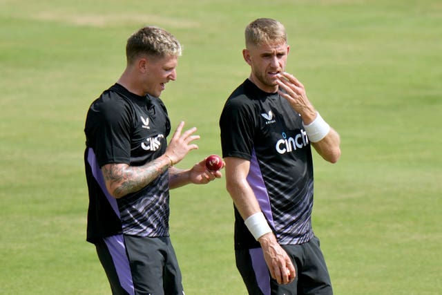 England’s Brydon Carse (left) chats with Olly Stone during a practice session, in Multan, Pakistan