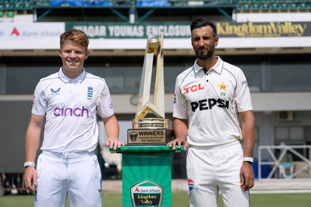 Ollie Pope and Shan Masood pose with the trophy