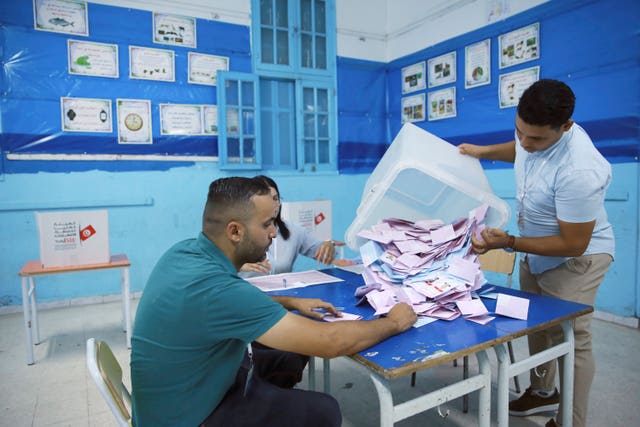 A ballot box is emptied onto a table ready for votes to be counted