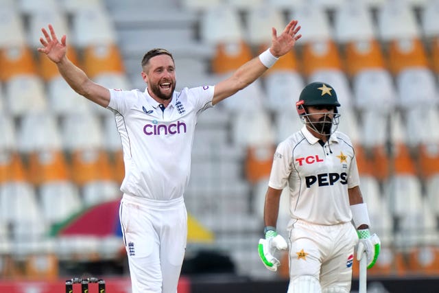 Chris Woakes celebrates taking a wicket 