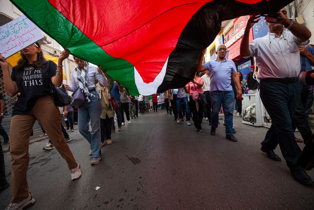 Protesters attend a rally in support of Gaza and Lebanon in Tunis, Tunisia