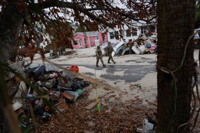 Members of the Florida Army National Guard check for any remaining residents in nearly-deserted Bradenton Beach