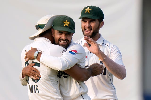 Pakistan’s Aamer Jamal, right, celebrates after taking the catch of England’s Ollie Pope