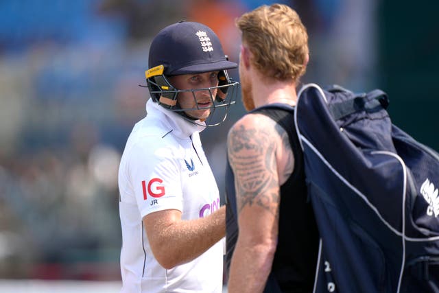 Joe Root is congratulated by Ben Stokes as he leaves the pitch at lunch