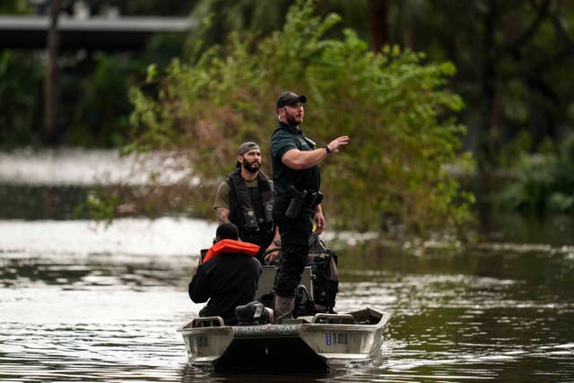 People are rescued from an apartment complex after flooding in the aftermath of Hurricane Milton,