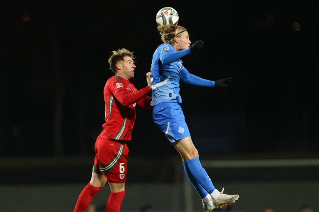 Wales'' Joe Rodon, left, challenges Iceland’s Andri Gudjohnsen