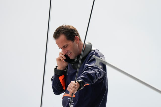 Sir Ben Ainslie talks on the phone