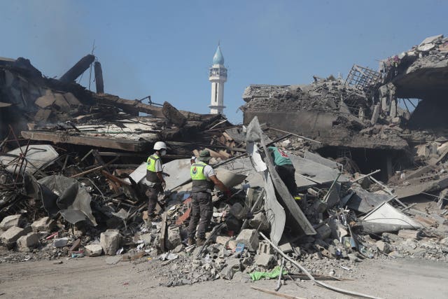 Rescue workers search for victims in the rubble of destroyed buildings in Lebanon