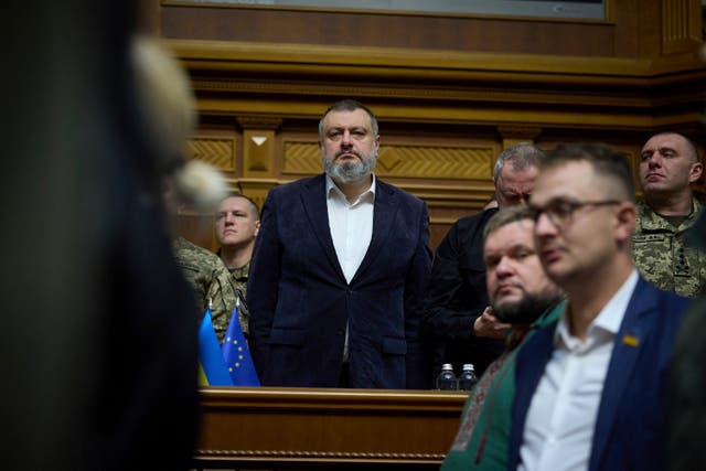 Oleksandr Lytvynenko, head of the Foreign Intelligence Service of Ukraine, listens to a speech by President Volodymyr Zelensky