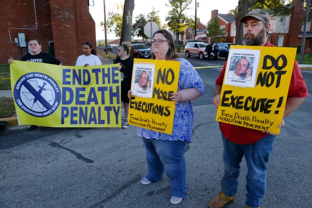 Protesters outside the prison where Robert Roberson was scheduled for execution in Huntsville, Texas