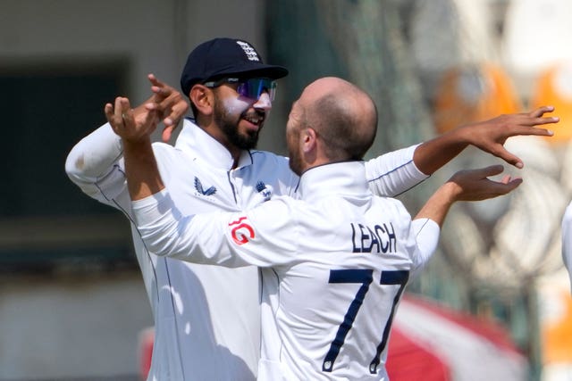 England spinners Jack Leach and Shoaib Bashir embrace after a wicket