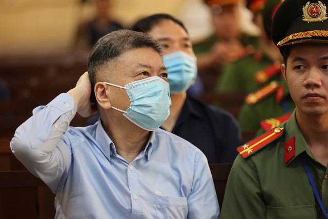 Lan's husband Chu Nap Kee sits in court 