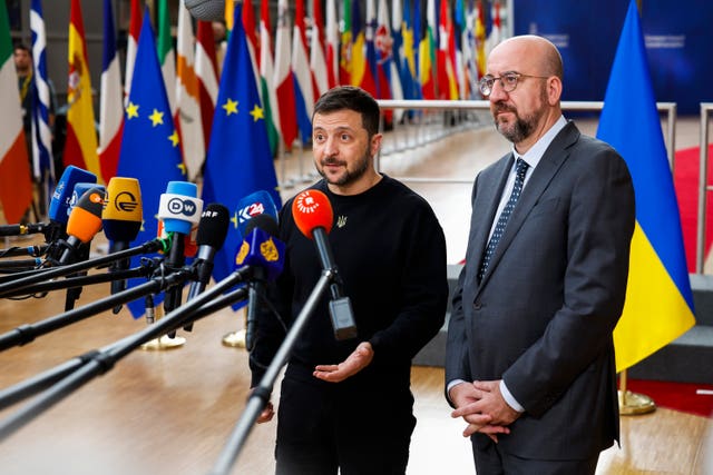 Ukrainian president Volodymyr Zelensky, left, and European Council president Charles Michel talk to journalists 