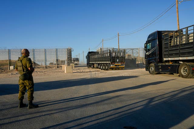 Trucks carrying humanitarian aid cross into the Gaza Strip from Erez crossing in southern Israel 