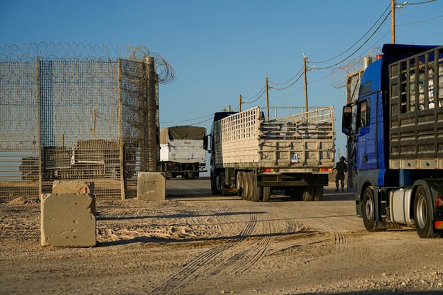 Trucks carrying humanitarian aid cross into the Gaza Strip 