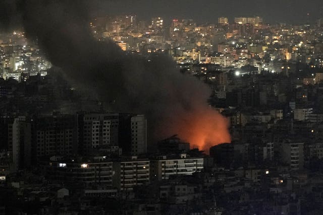 Flames and smoke rise form an Israeli airstrike on Dahiyeh, in the southern suburb of Beirut