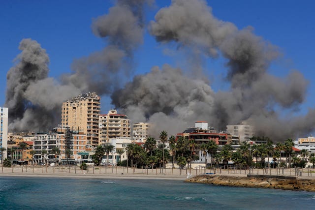 Smoke rises from buildings