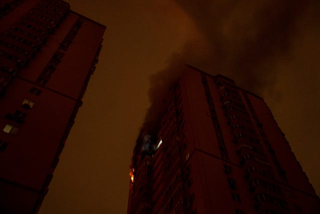 A residential building burns after an attack of Russian drones killed a teenager in Kyiv, Ukraine 