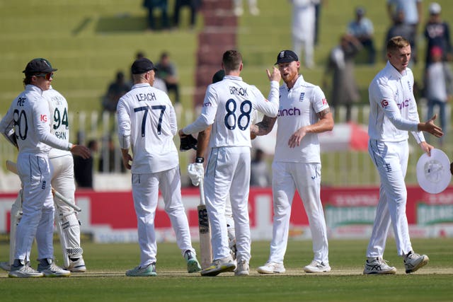 Ben Stokes shakes hands with his England team-mates after their defeat