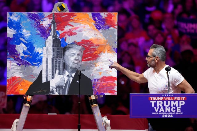 Scott Lobaido unveils a painting of Donald Trump