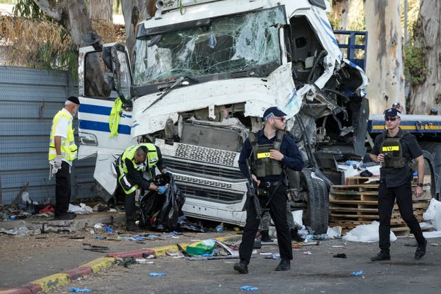 Israeli police and rescue services inspect a crash site