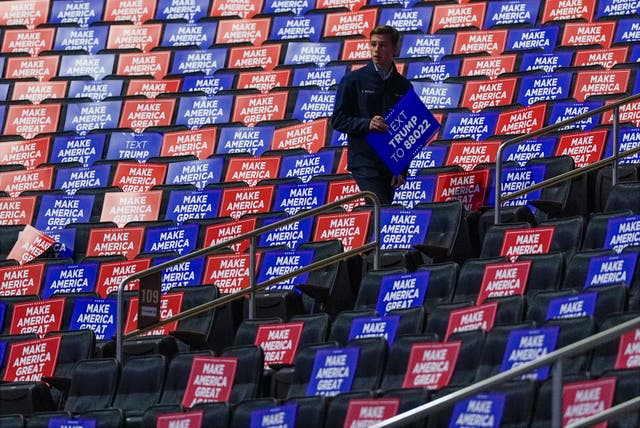 Signs on seats in large auditorium