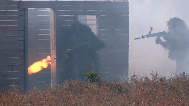 Russian soldiers attend combat training for assault units at an undisclosed location in Ukraine