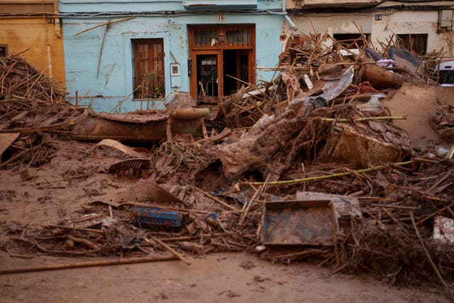 A house covered in mud is pictured in an area affected by floods in Valencia