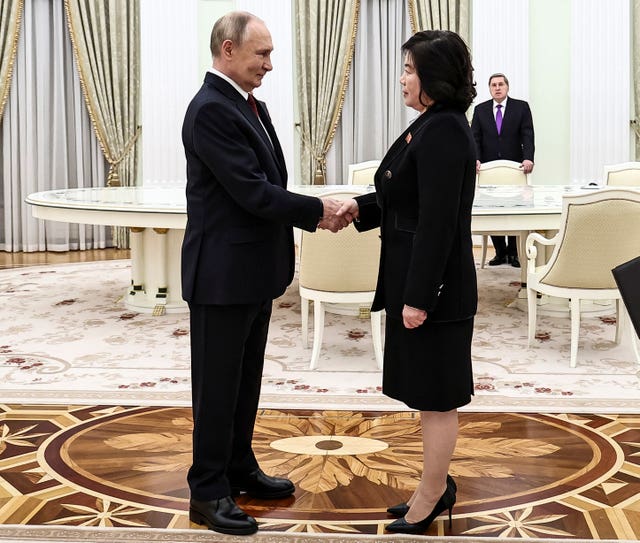 Vladimir Putin greets North Korean foreign minister Choe Son Hui during their meeting at the Kremlin