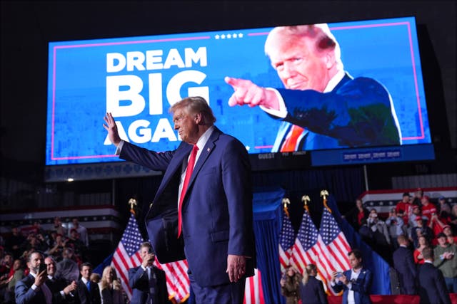 Donald Trump waves at a campaign rally