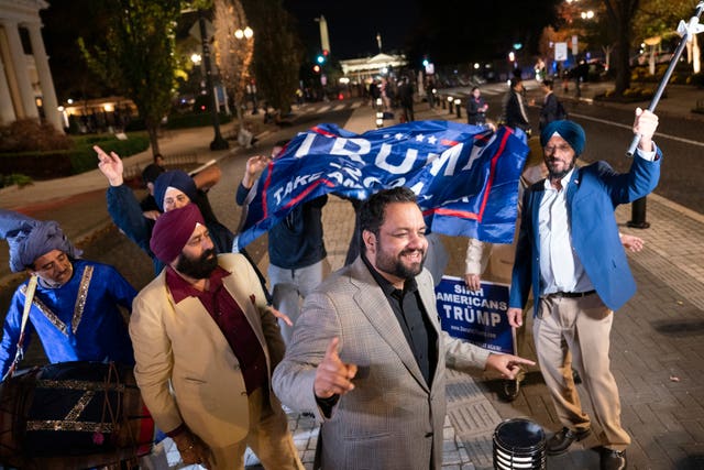 Supporters of Republican presidential nominee Donald Trump dancing outside the White House in Washington DC