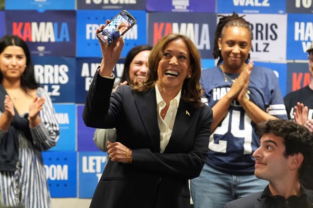 Democratic presidential nominee Vice President Kamala Harris, left, phone banks with volunteers at the DNC headquarters on Election Day