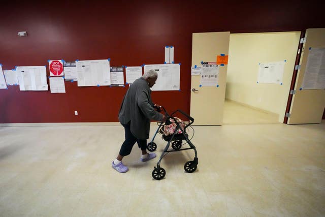 Alfredia Washington arrives to vote at the Household of Faith Church in New Orleans on Election Day