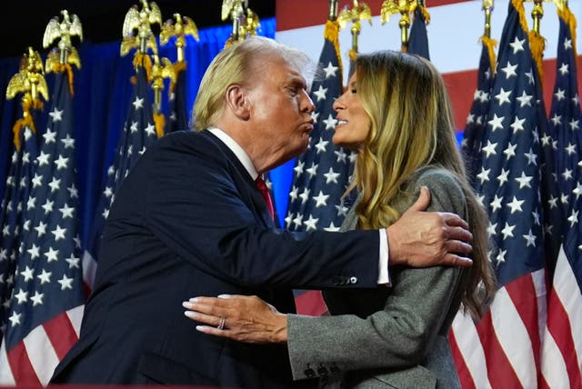 Donald Trump kisses former first lady Melania Trump at an election night watch party at the Palm Beach Convention Centre in Florida 