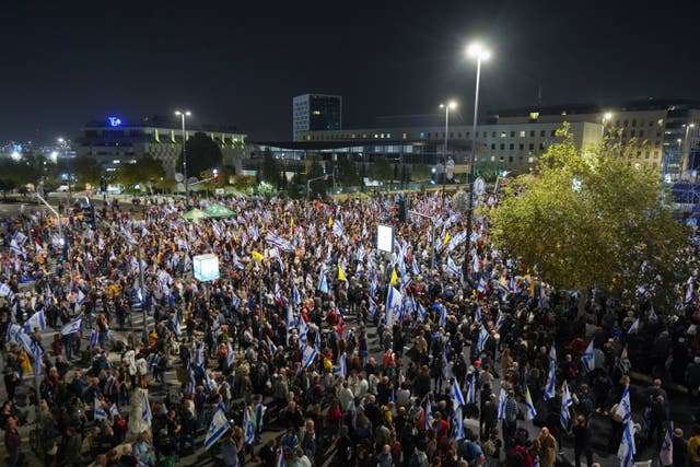 People protest against Prime Minister Benjamin Netanyahu after he dismissed defence minister Yoav Gallant