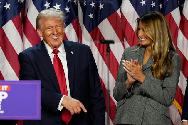 Donald Trump dances as Melania Trump looks on